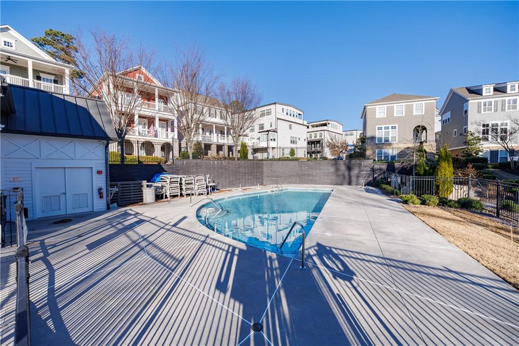 2067 Wheaton Way Atlanta, GA 30328 - Photo 62 of 64 a view of a swimming pool with outdoor seating