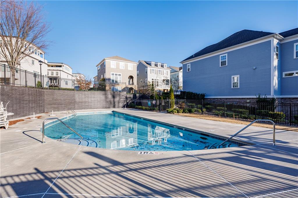 2067 Wheaton Way Atlanta, GA 30328 - Photo 63 of 64 a swimming pool with outdoor seating and yard