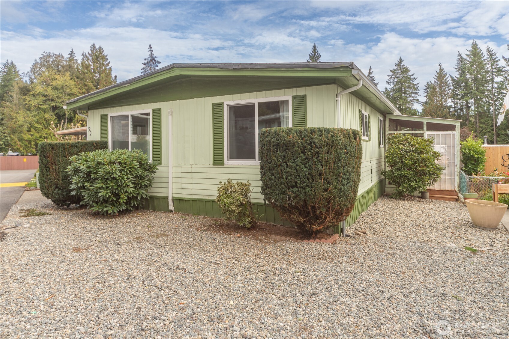 front view of a house with a bench