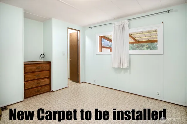 a view of a bedroom with an empty space