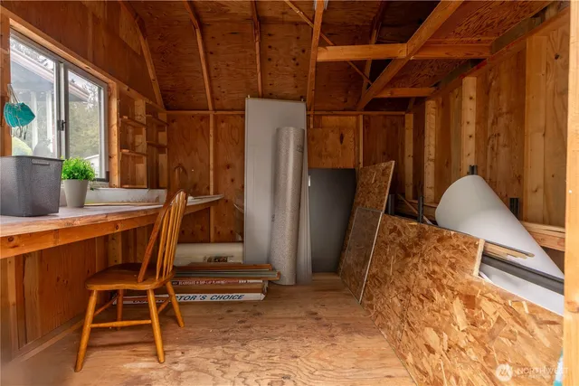 a view of a house with swimming pool and sitting area