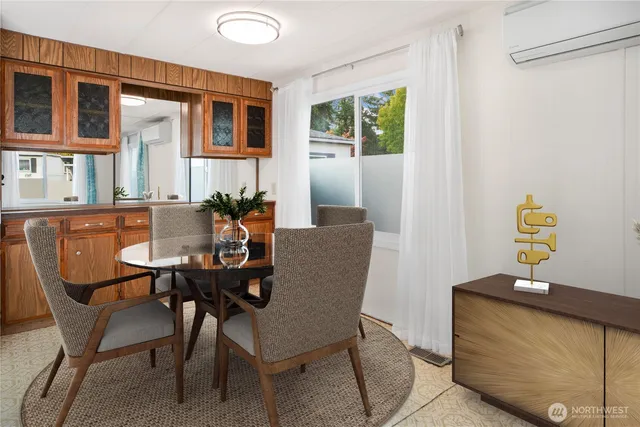 a dining room with furniture and window