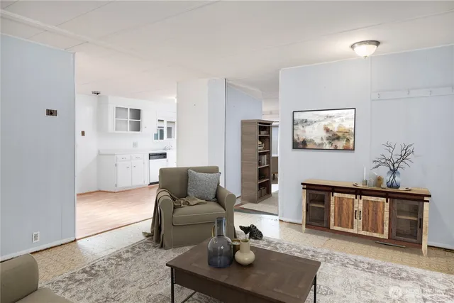 a living room with furniture and a rug