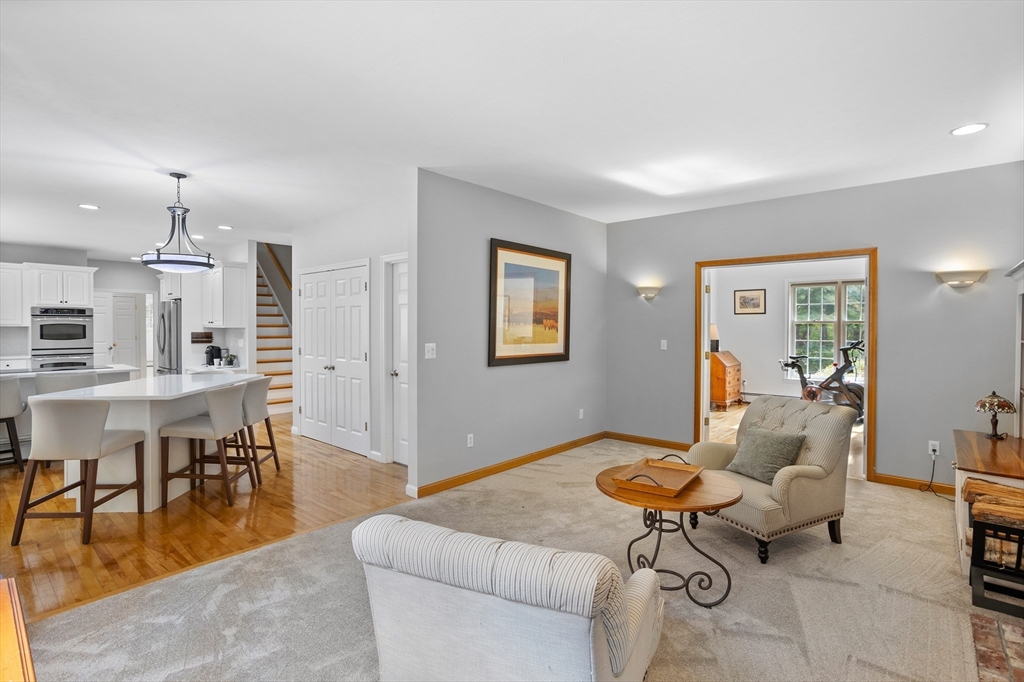 104 Green Road Bolton, MA 01740 - Photo 12 of 42 a living room with furniture and a table