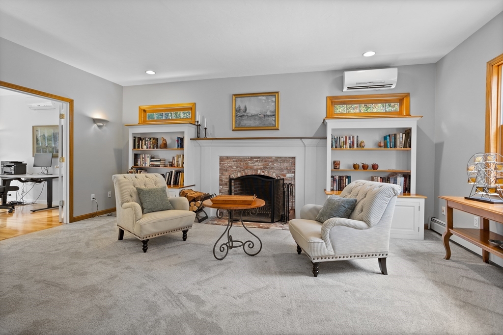 104 Green Road Bolton, MA 01740 - Photo 13 of 42 a living room with furniture and a fireplace