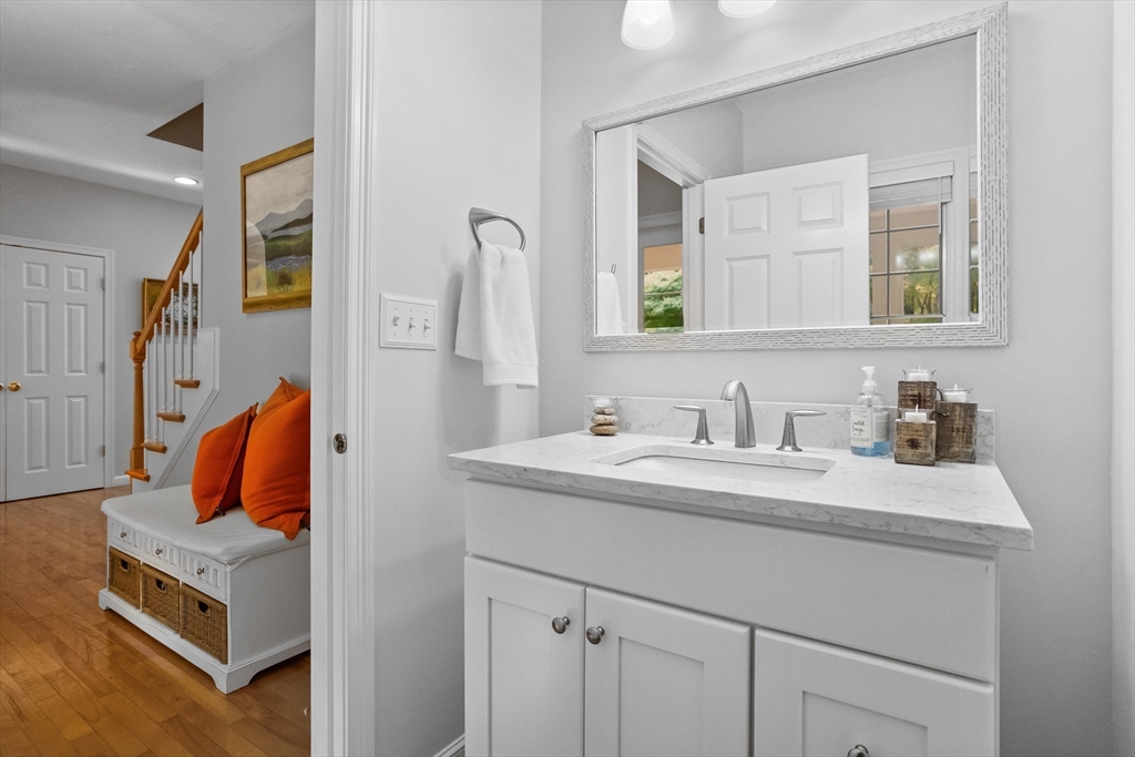 104 Green Road Bolton, MA 01740 - Photo 21 of 42 a en suite bathroom with a sink and a mirror