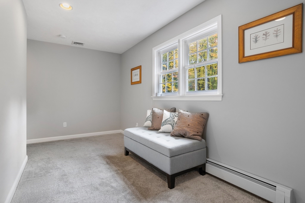 104 Green Road Bolton, MA 01740 - Photo 22 of 42 a living room with furniture and windows
