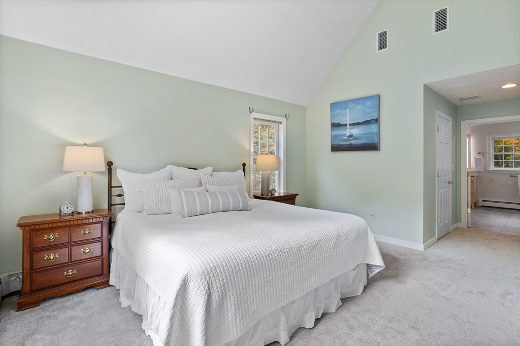 104 Green Road Bolton, MA 01740 - Photo 24 of 42 a bedroom with a bed and a night stand