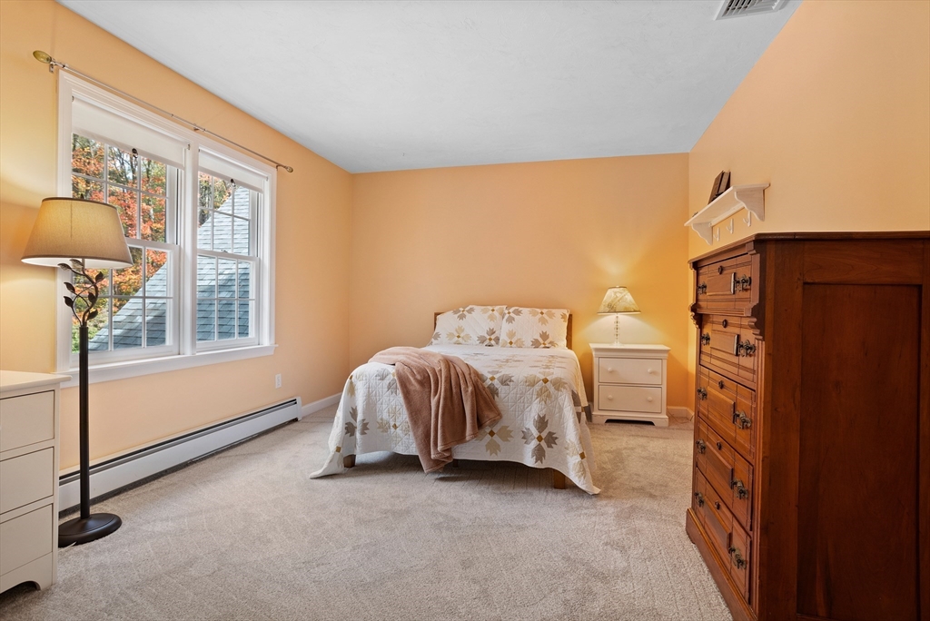 104 Green Road Bolton, MA 01740 - Photo 27 of 42 a bedroom with a bed and a window