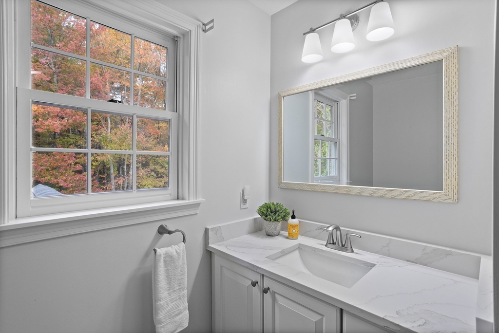 104 Green Road Bolton, MA 01740 - Photo 29 of 42 a bathroom with a sink a vanity and a window