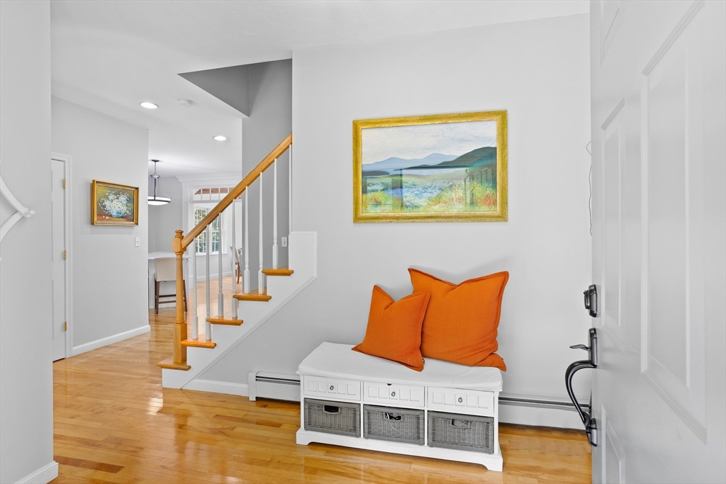 104 Green Road Bolton, MA 01740 - Photo 3 of 42 a room with wooden floor and furniture