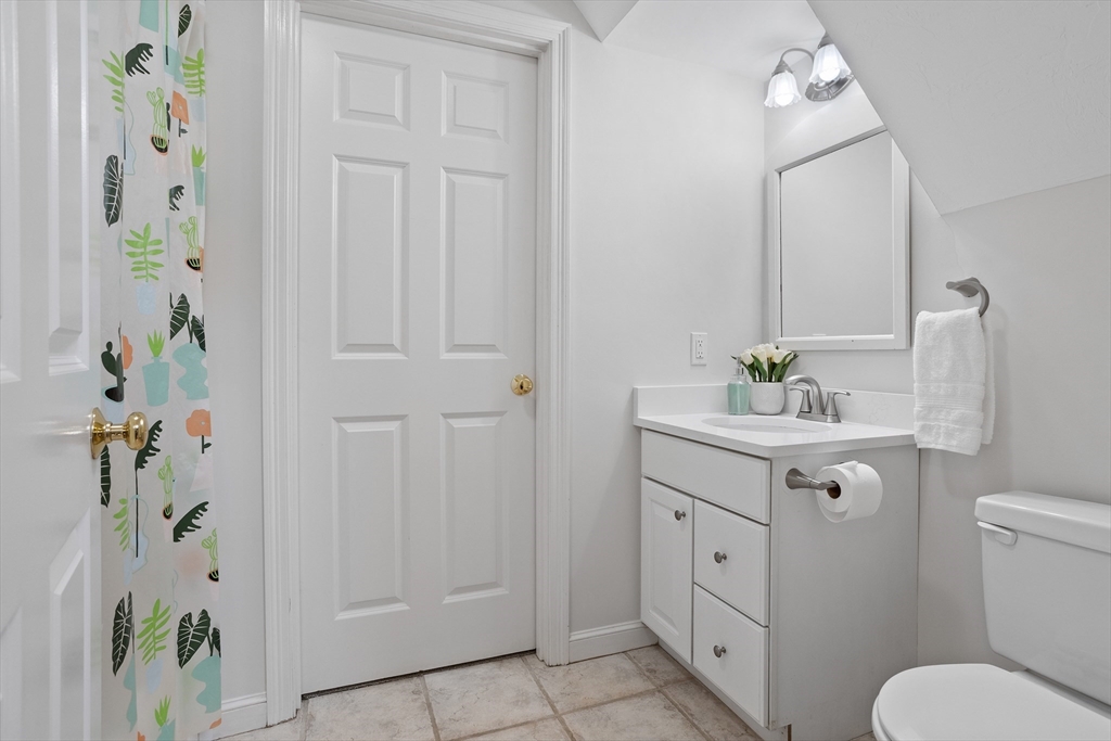 104 Green Road Bolton, MA 01740 - Photo 31 of 42 a bathroom with a sink a toilet and shower curtain