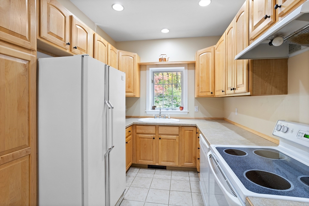 104 Green Road Bolton, MA 01740 - Photo 33 of 42 a kitchen that has a sink a stove and a refrigerator
