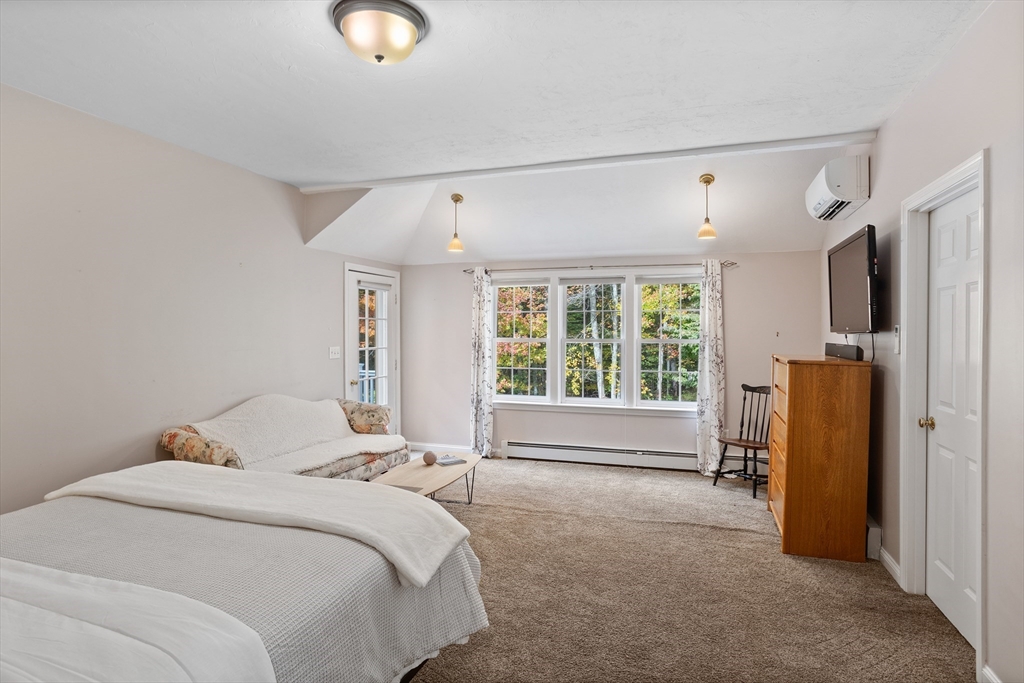 104 Green Road Bolton, MA 01740 - Photo 34 of 42 a bedroom with bed and a large window