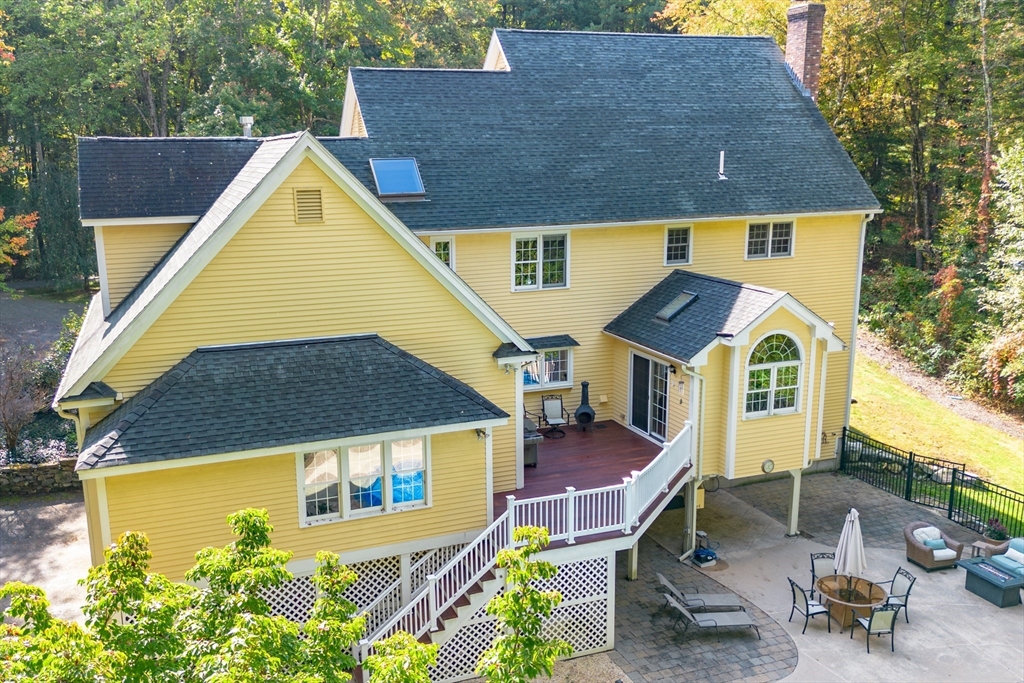 104 Green Road Bolton, MA 01740 - Photo 39 of 42 an aerial view of a house with swimming pool and porch