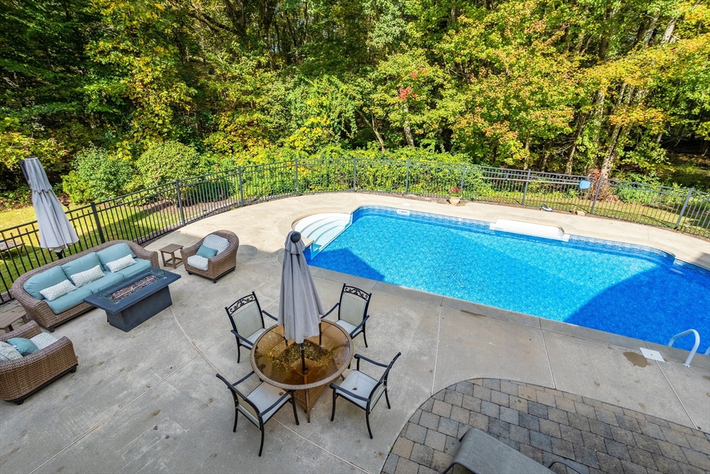 104 Green Road Bolton, MA 01740 - Photo 40 of 42 a view of a chairs and table in the patio