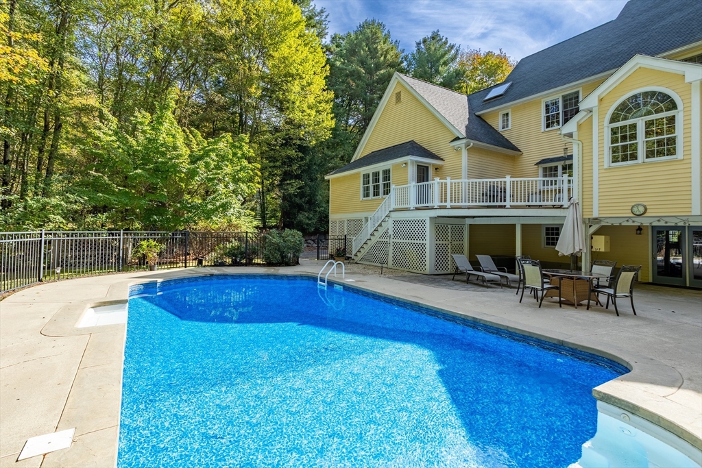 104 Green Road Bolton, MA 01740 - Photo 41 of 42 a view of house and outdoor space with swimming pool