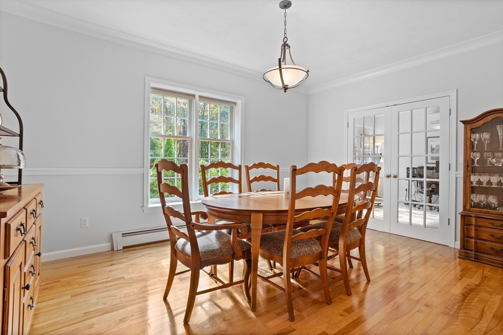 104 Green Road Bolton, MA 01740 - Photo 5 of 42 a view of a dining room with furniture window and wooden floor