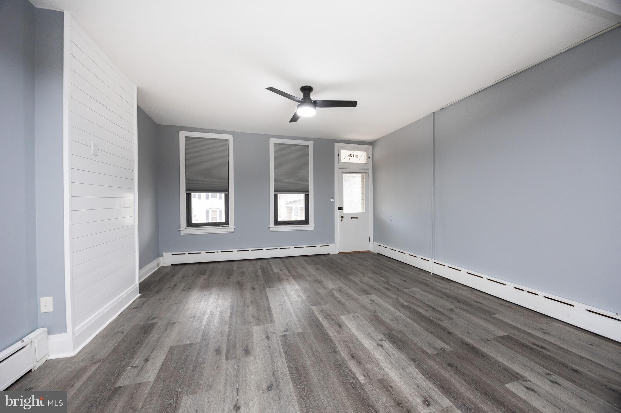 313 Chestnut Street Spring City, PA 19475 - Photo 18 of 38 wooden floor in an empty room with a window