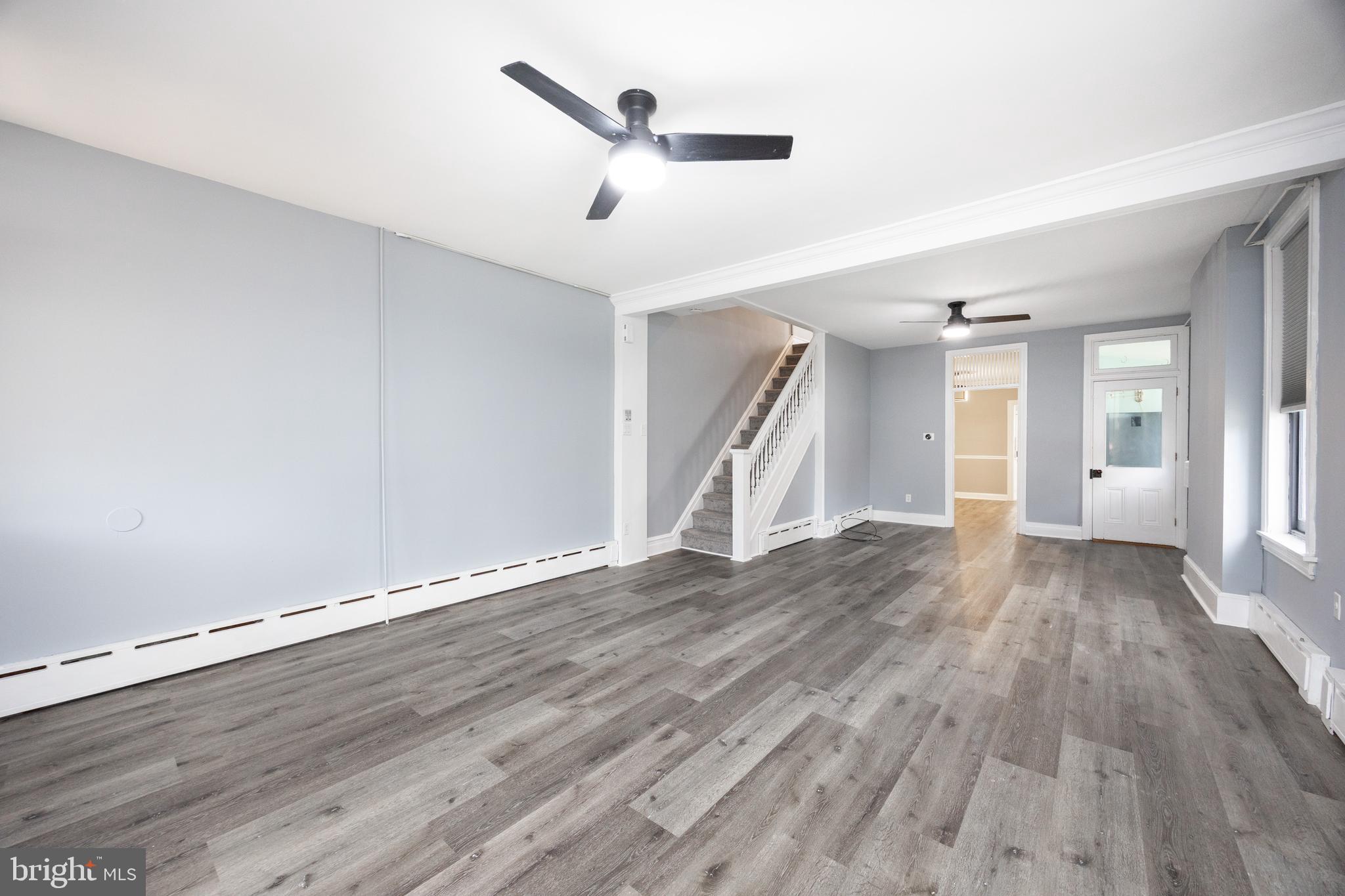 313 Chestnut Street Spring City, PA 19475 - Photo 19 of 38 an empty room with wooden floor and a ceiling fan