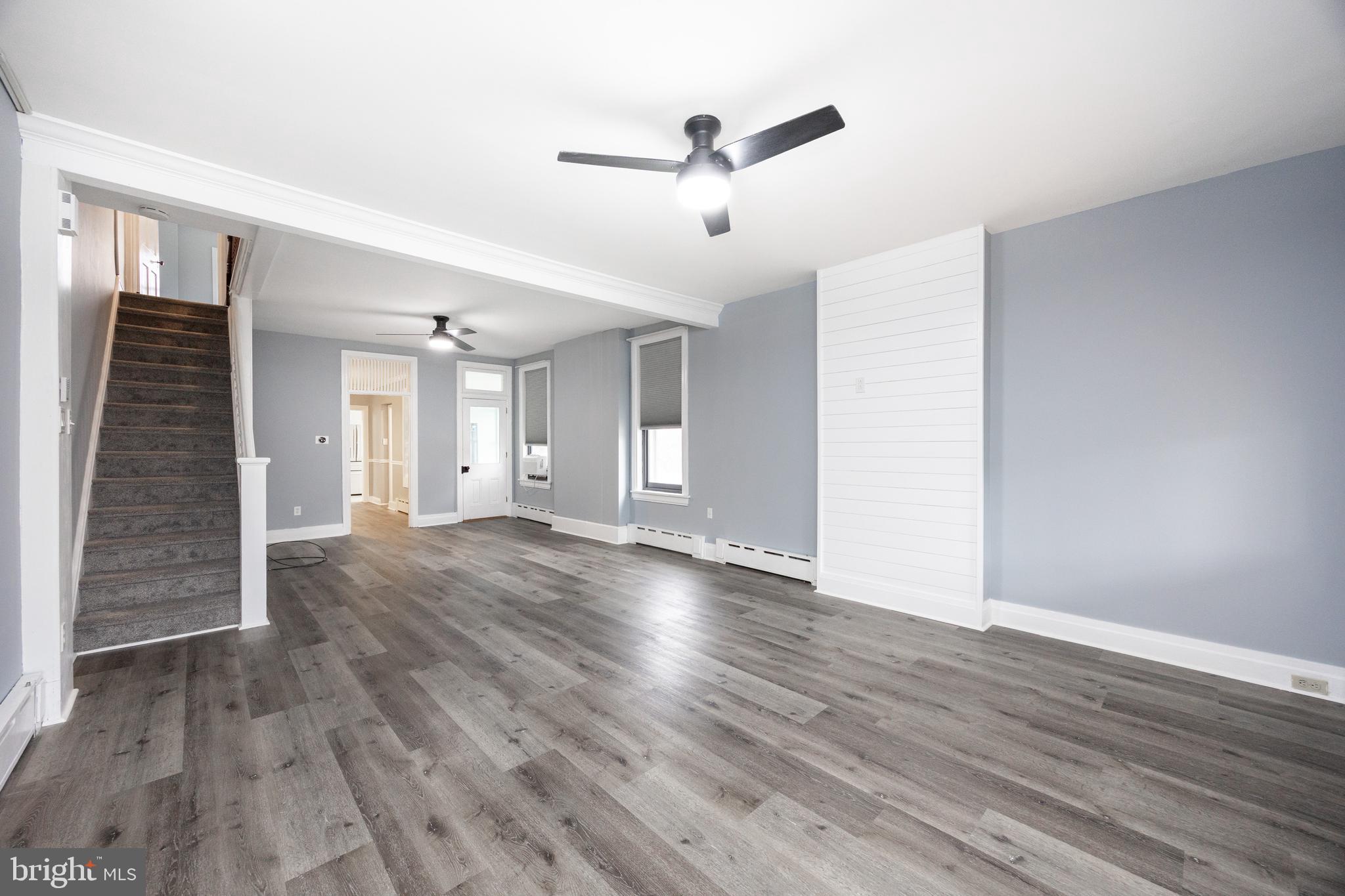 313 Chestnut Street Spring City, PA 19475 - Photo 20 of 38 a view of an empty room with wooden floor and a ceiling fan