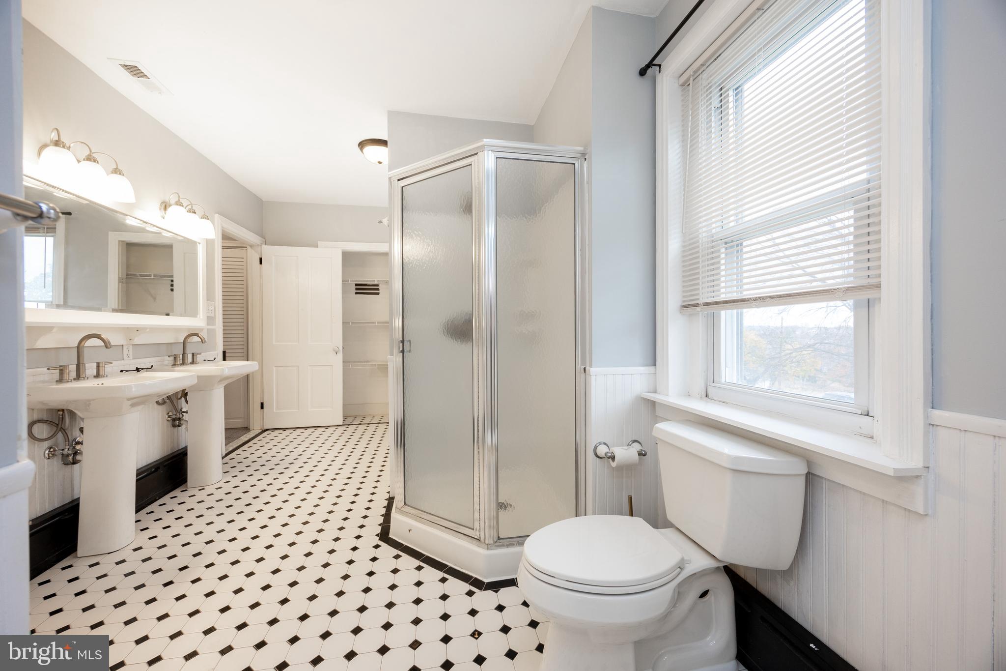 313 Chestnut Street Spring City, PA 19475 - Photo 26 of 38 a bathroom with a sink a toilet a window and a mirror