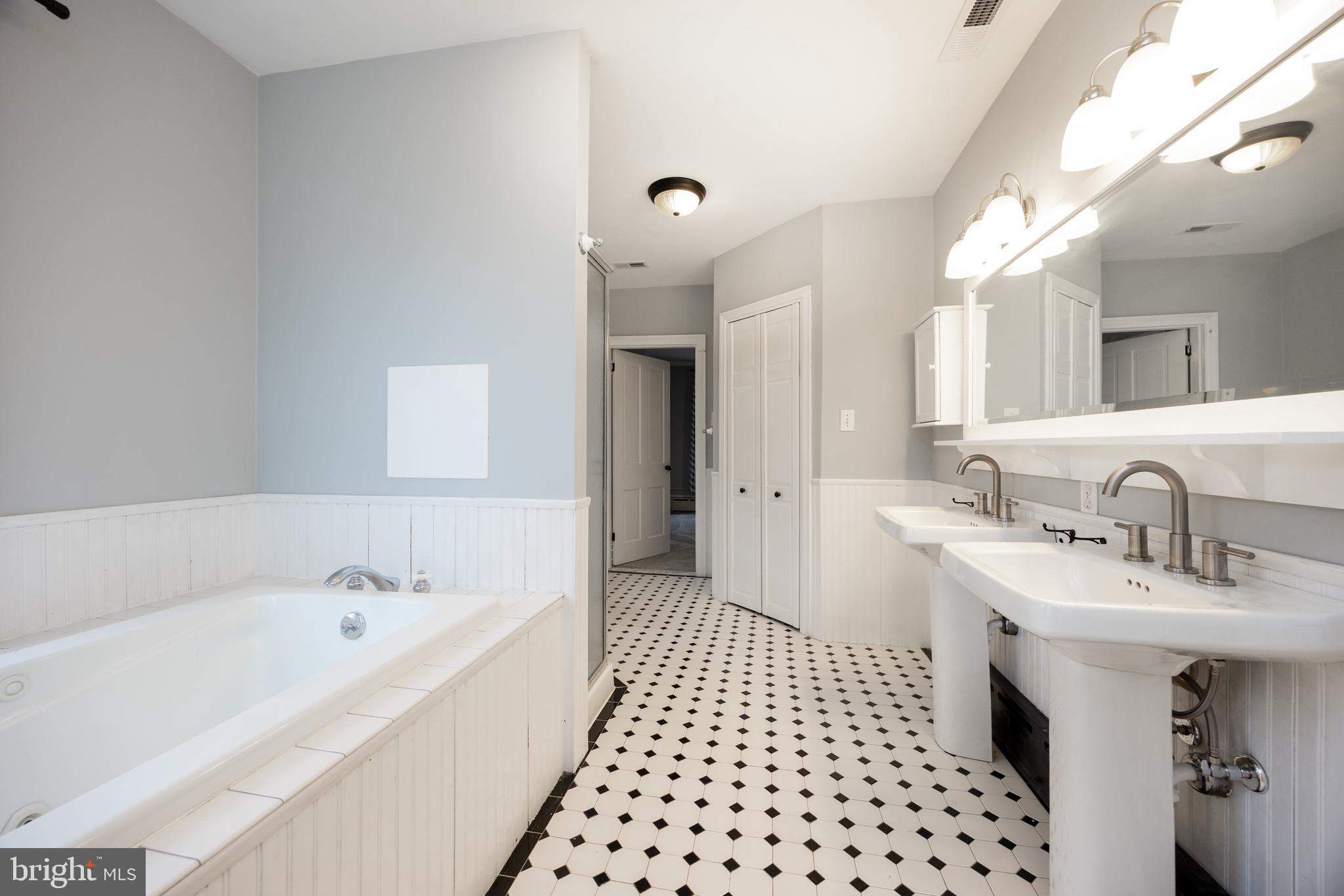 313 Chestnut Street Spring City, PA 19475 - Photo 27 of 38 a bathroom with a bathtub a sink a shower and a mirror