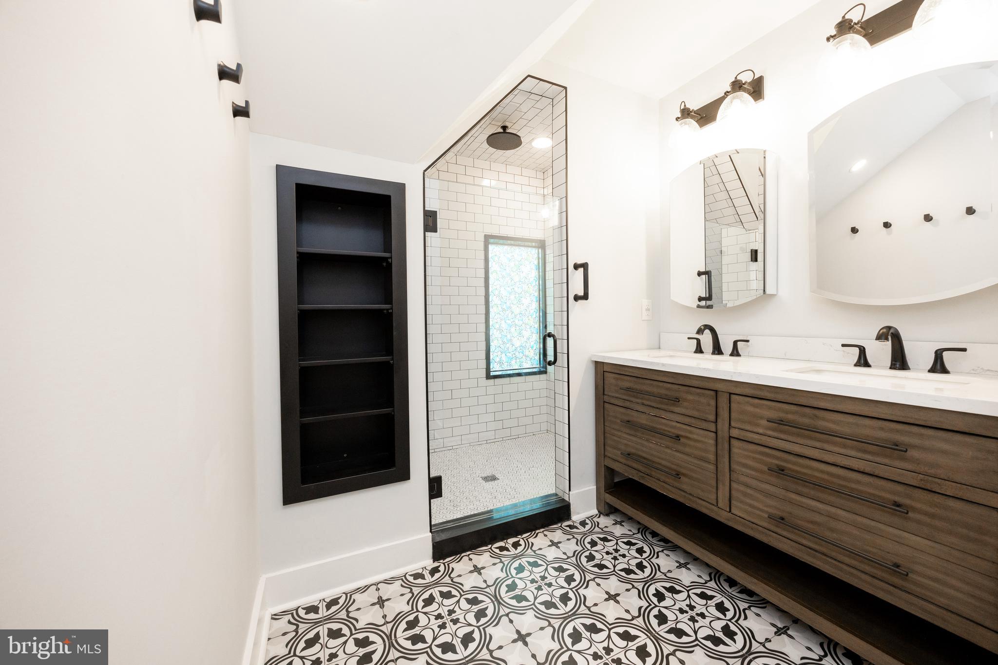 313 Chestnut Street Spring City, PA 19475 - Photo 37 of 38 a spacious bathroom with a double vanity sink a mirror and a shower