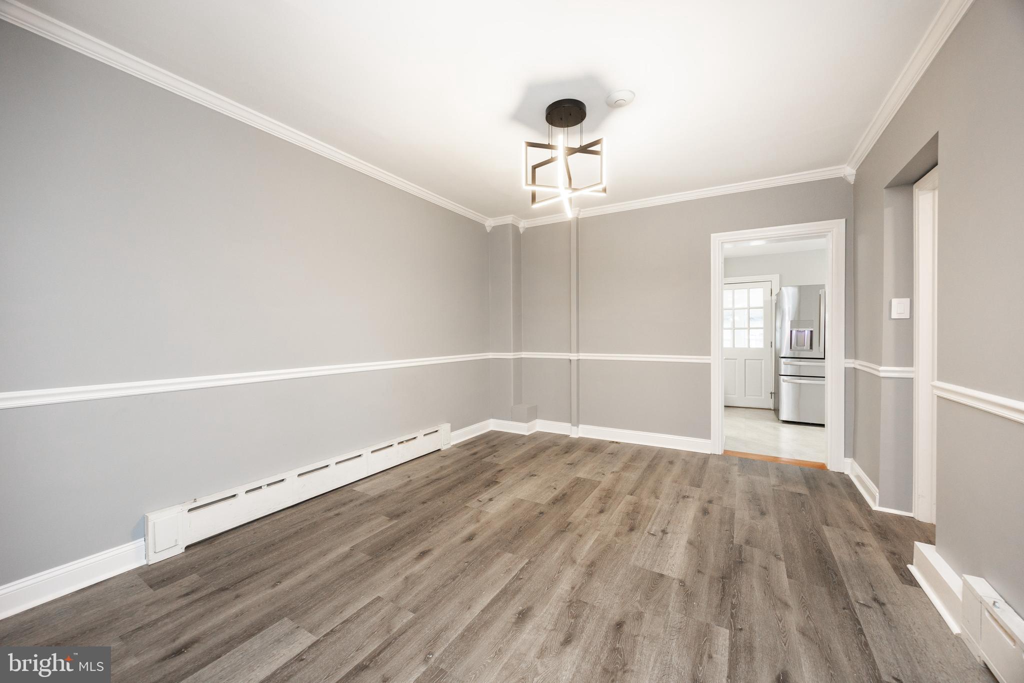 313 Chestnut Street Spring City, PA 19475 - Photo 8 of 38 an empty room with wooden floor and windows