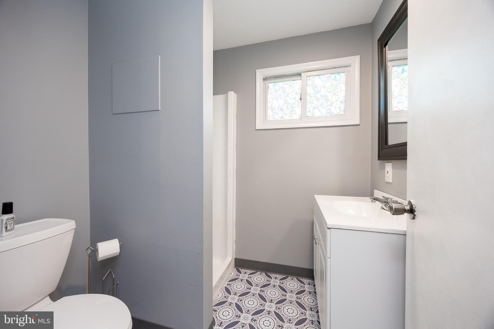313 Chestnut Street Spring City, PA 19475 - Photo 10 of 38 a bathroom with a toilet sink and mirror