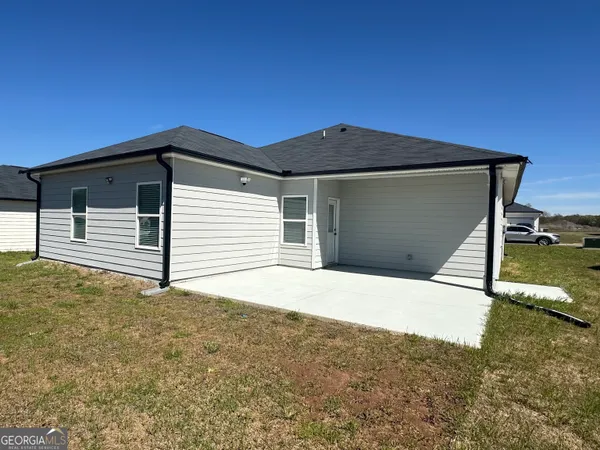a front view of a house with garage