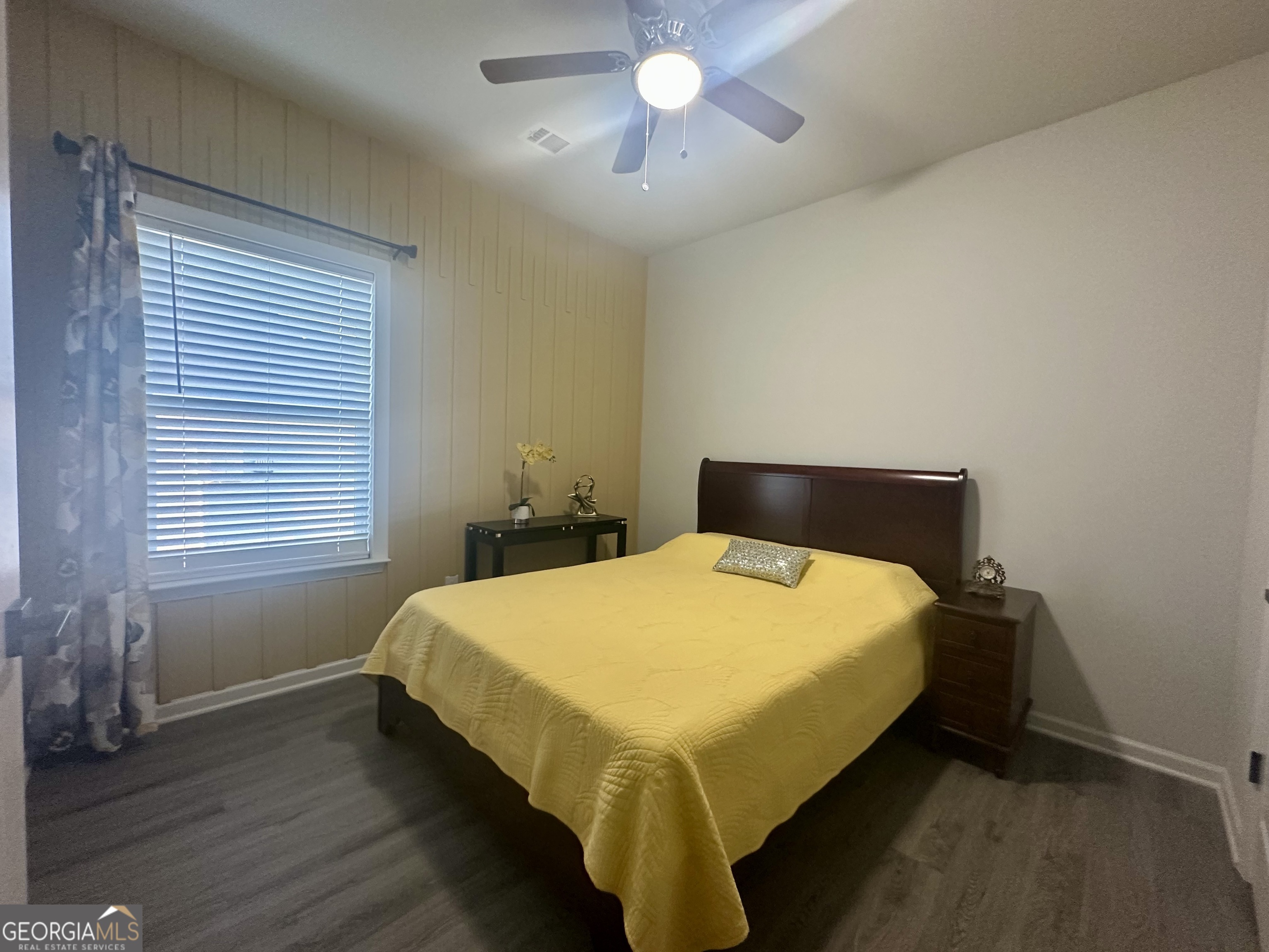 604 Georgian Walk Byron, GA 31008 - Photo 15 of 15 a bed sitting in a bedroom next to a window