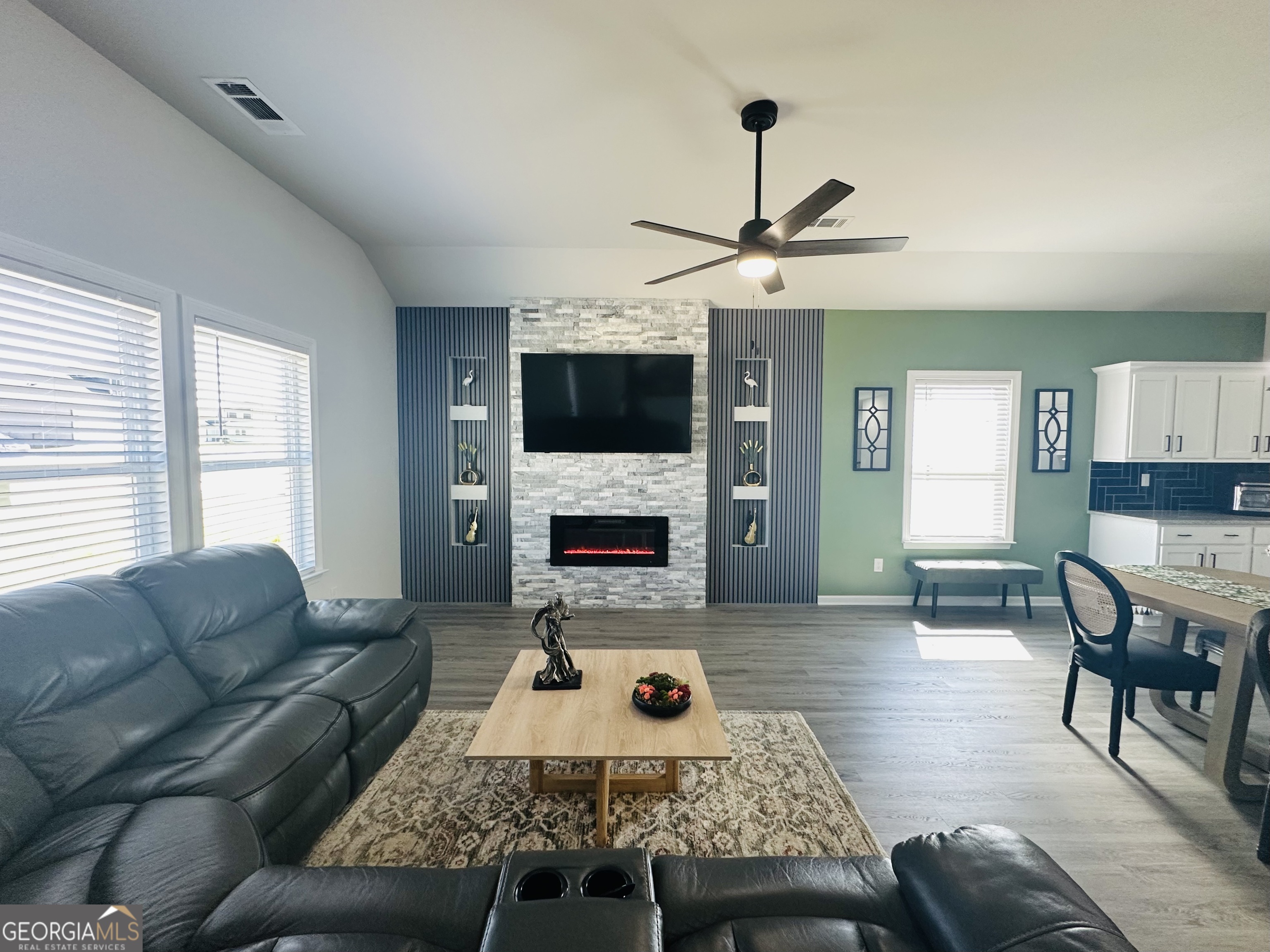 604 Georgian Walk Byron, GA 31008 - Photo 2 of 15 a living room with furniture a fireplace and a flat screen tv