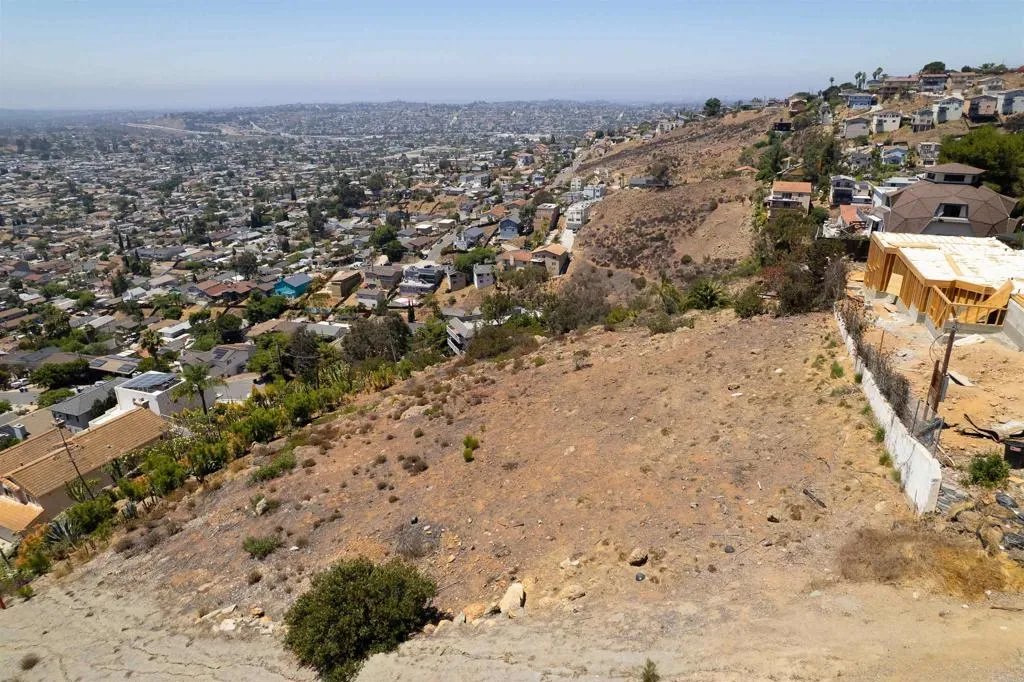 0 La Mesa Spring Valley Spring Valley, CA 91977 - Photo 5 of 12 a view of a dry yard with wooden fence