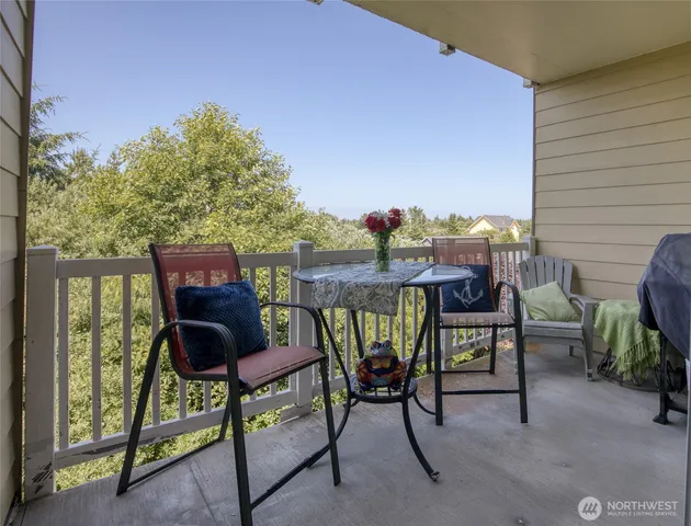a view of an chairs and table in the patio