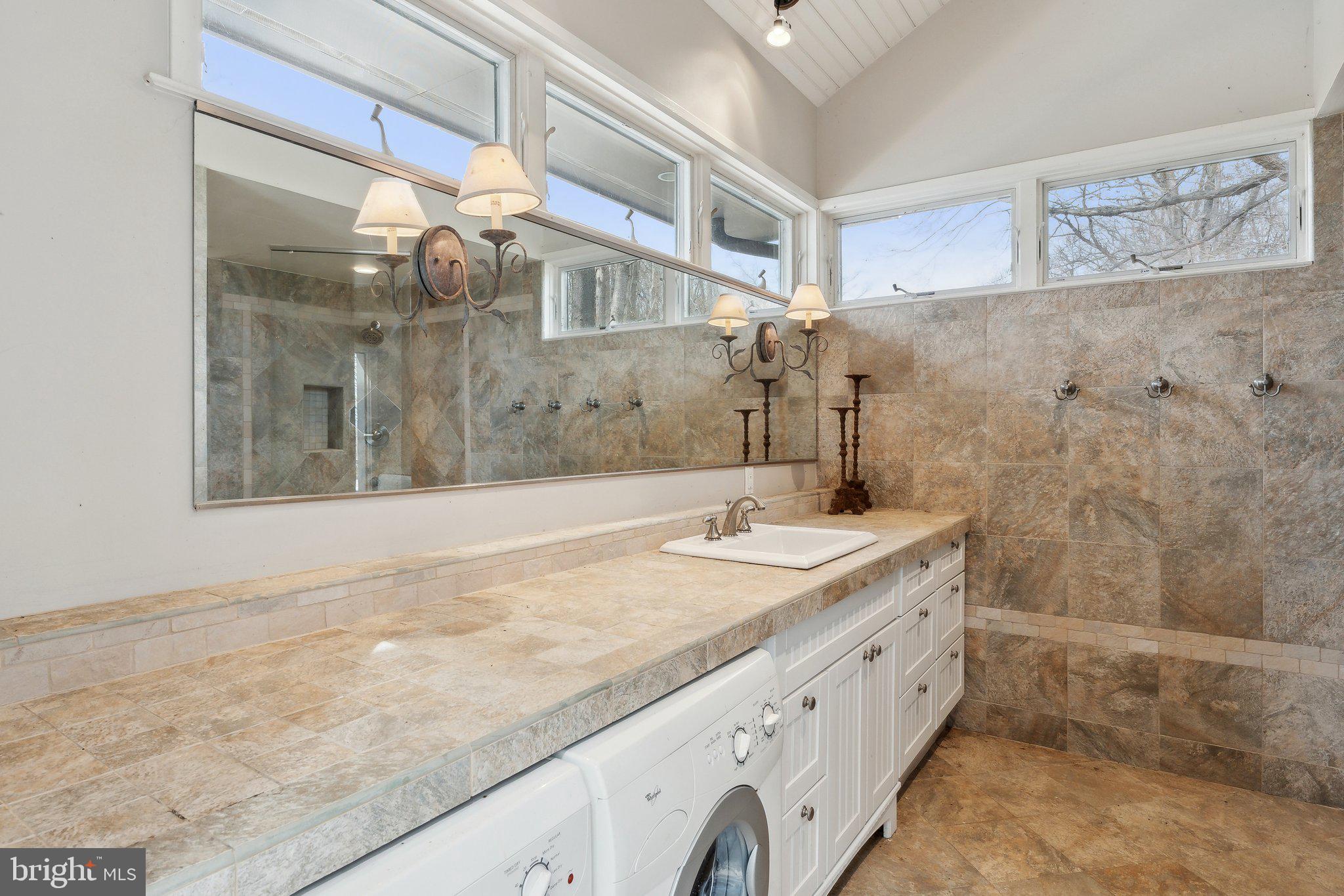 18600 Barnesville Road Barnesville, MD 20838 - Photo 65 of 108 a bathroom with a granite countertop sink a mirror and shower
