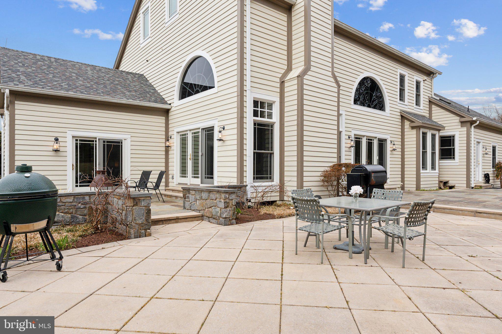 18600 Barnesville Road Barnesville, MD 20838 - Photo 76 of 108 a view of a patio with dining table and chairs with wooden floor
