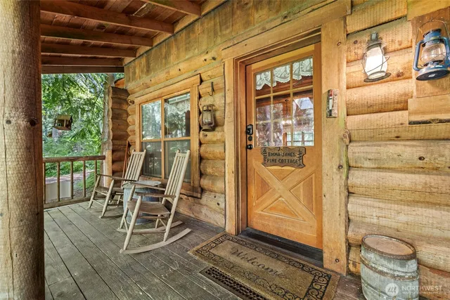 a view of a outdoor chairs and table in the balcony
