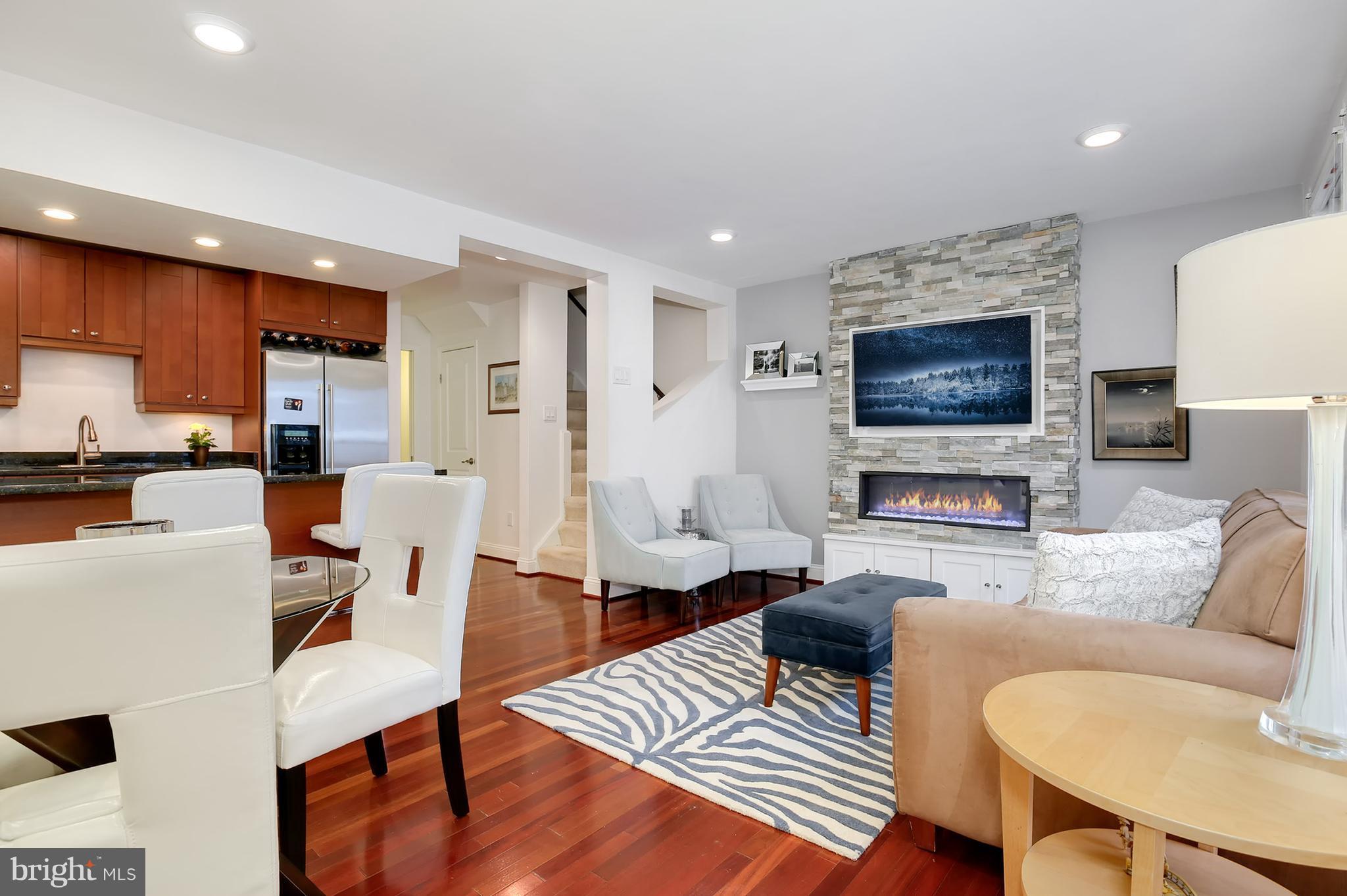 1119 Harvard Street Northwest, Unit R Washington, DC 20009 - Photo 2 of 26 a living room with furniture and a flat screen tv