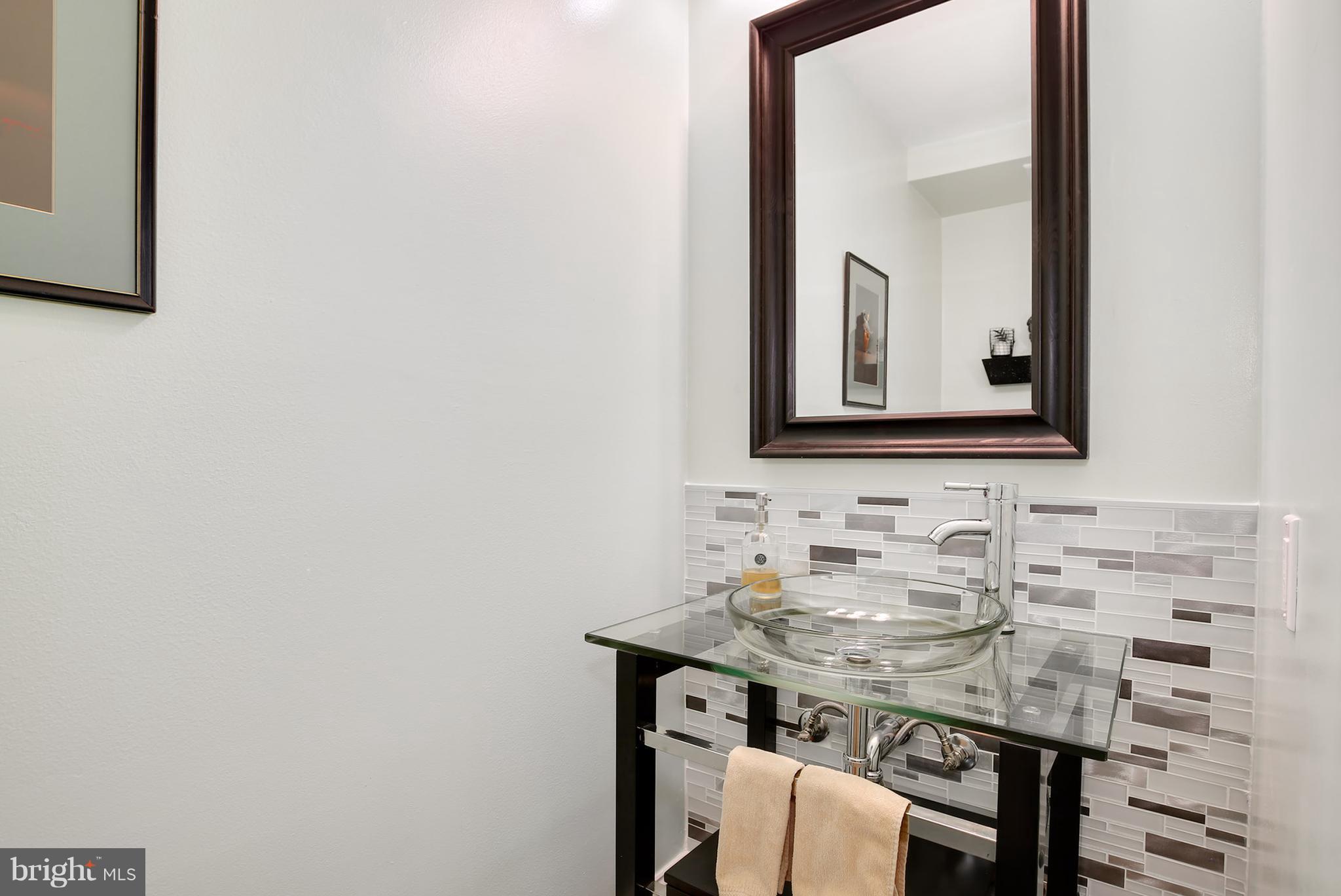 1119 Harvard Street Northwest, Unit R Washington, DC 20009 - Photo 16 of 26 a bathroom with a sink and a mirror