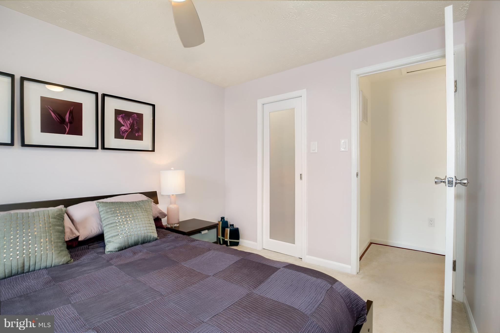 1119 Harvard Street Northwest, Unit R Washington, DC 20009 - Photo 22 of 26 a bedroom with a bed and hallway