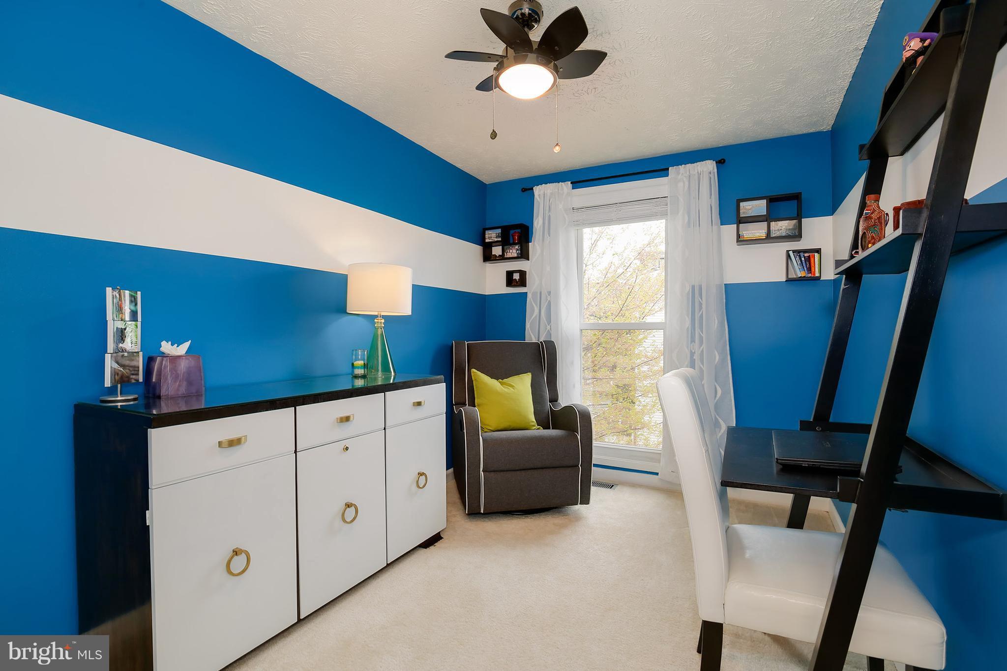 1119 Harvard Street Northwest, Unit R Washington, DC 20009 - Photo 23 of 26 a living room with furniture and a window