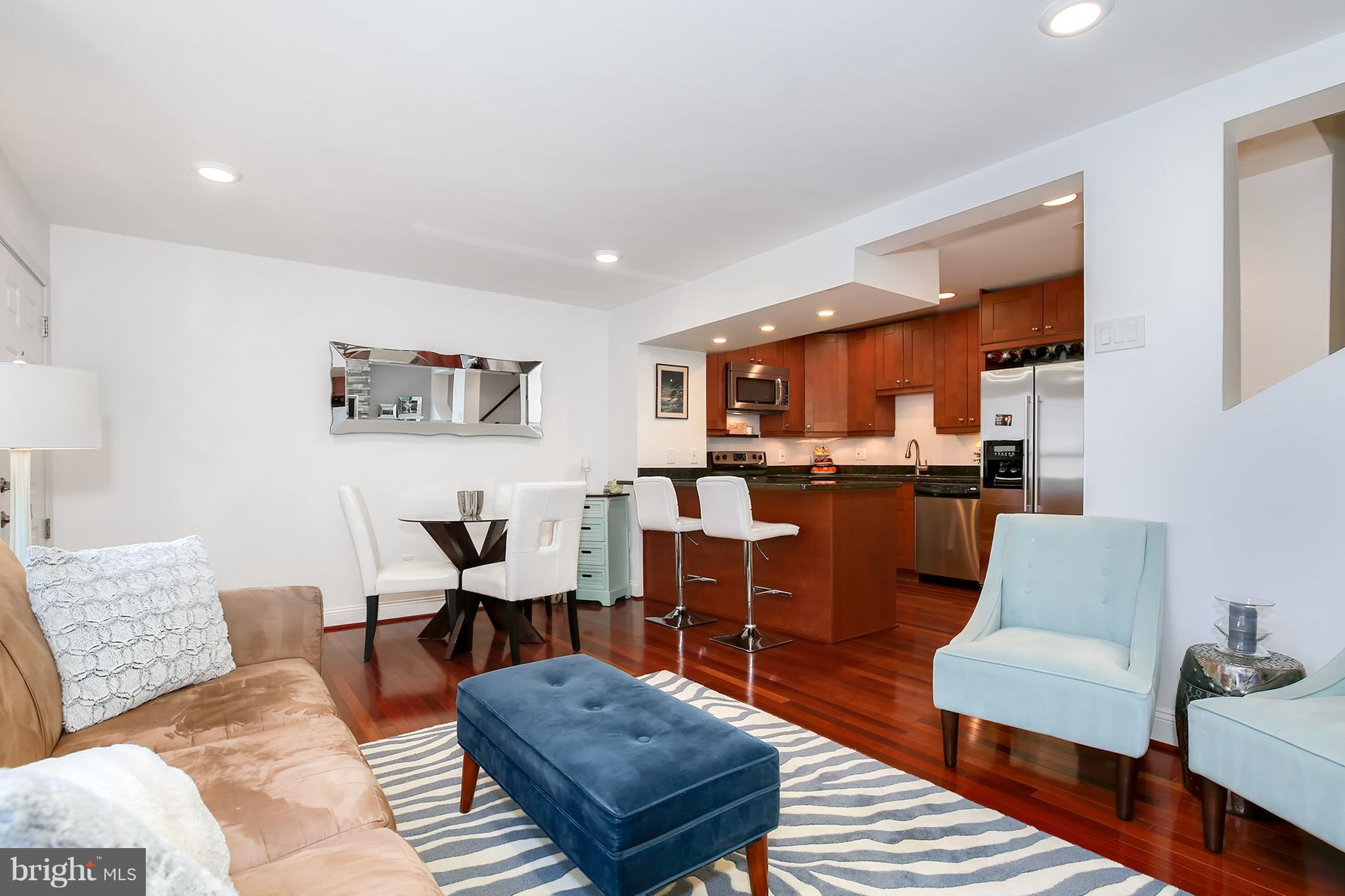 1119 Harvard Street Northwest, Unit R Washington, DC 20009 - Photo 7 of 26 a living room with furniture kitchen view and a table
