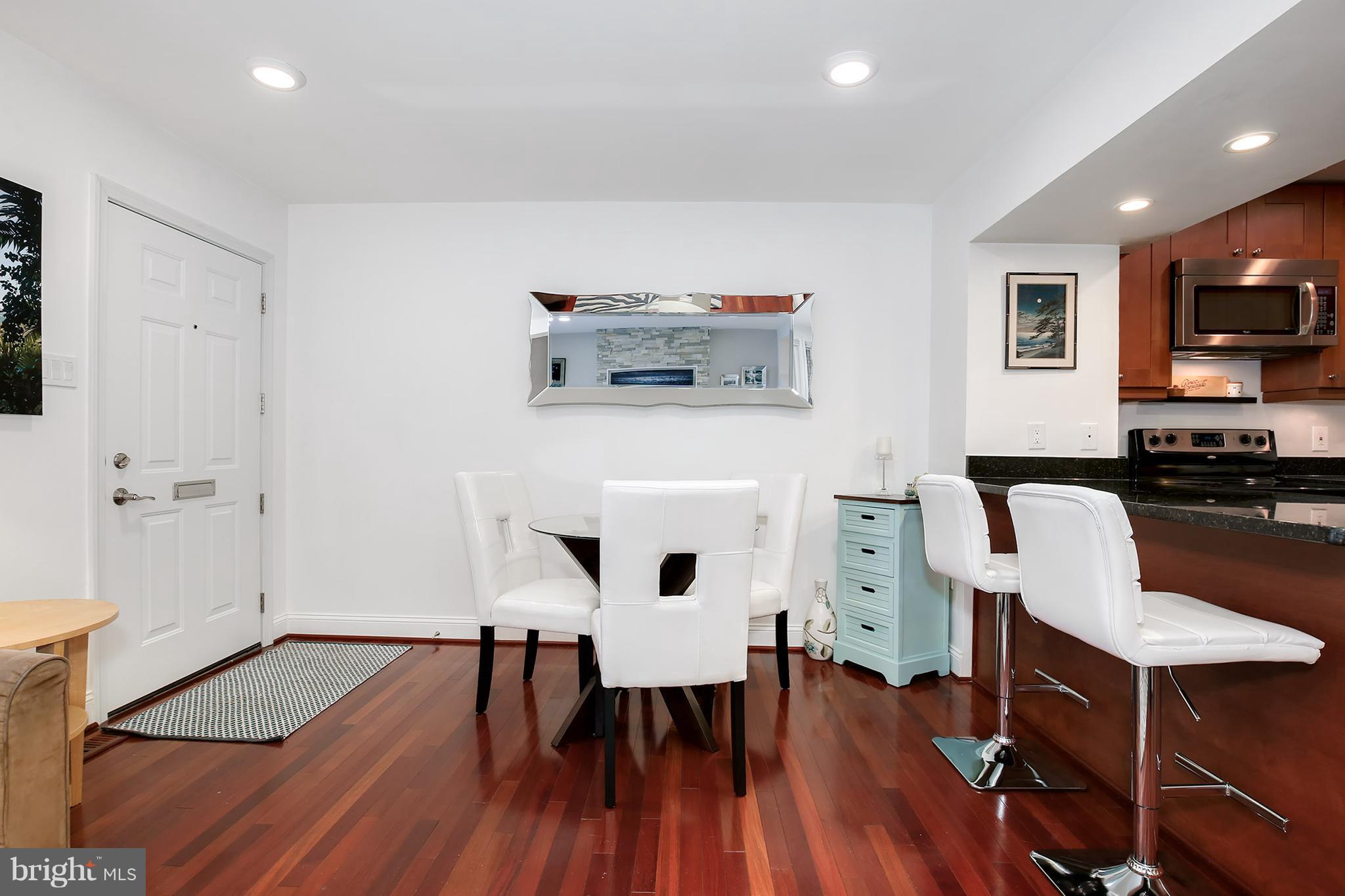1119 Harvard Street Northwest, Unit R Washington, DC 20009 - Photo 8 of 26 a view of kitchen with cabinets and wooden floor