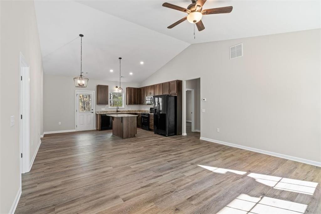 146 Old Brock Road Rockmart, GA 30153 - Photo 12 of 45 a view of kitchen with refrigerator stove and wooden floor