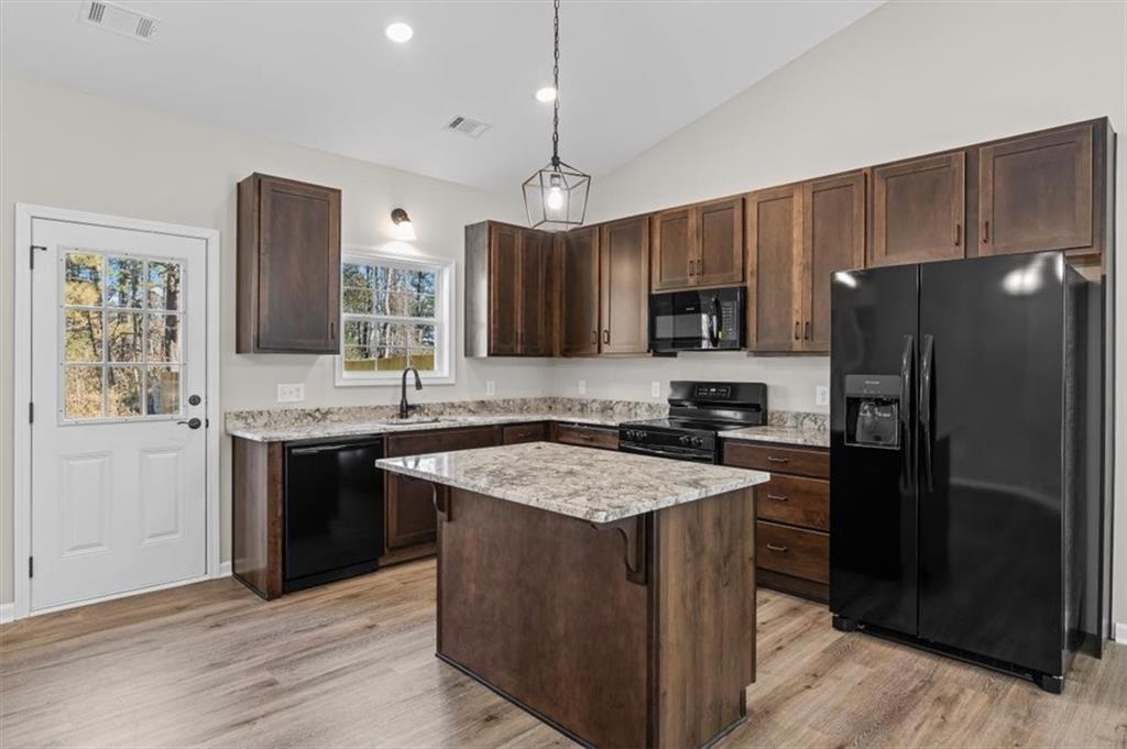 146 Old Brock Road Rockmart, GA 30153 - Photo 15 of 45 a kitchen with stainless steel appliances granite countertop a sink stove and refrigerator
