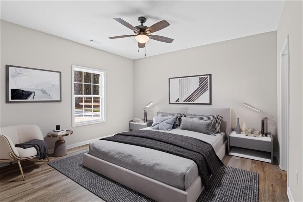 146 Old Brock Road Rockmart, GA 30153 - Photo 22 of 45 a bedroom with a large bed couch and a window