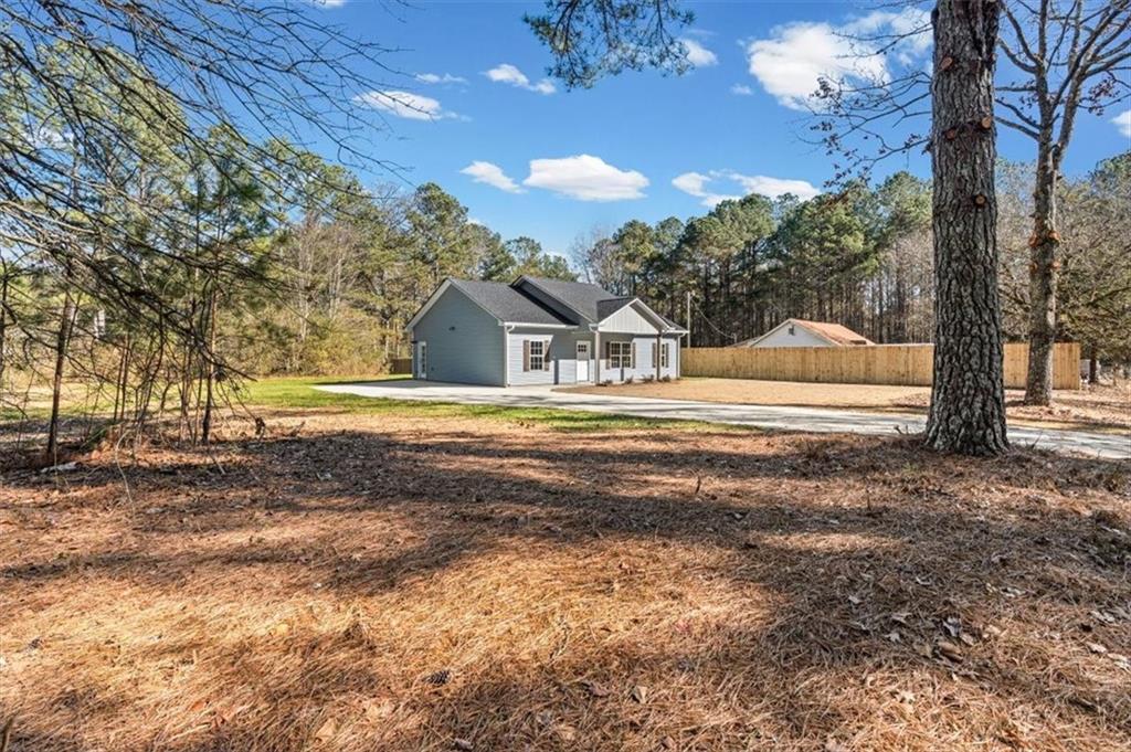 146 Old Brock Road Rockmart, GA 30153 - Photo 3 of 45 a view of the house with a big yard