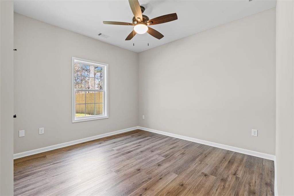 146 Old Brock Road Rockmart, GA 30153 - Photo 31 of 45 wooden floor in an empty room with a window