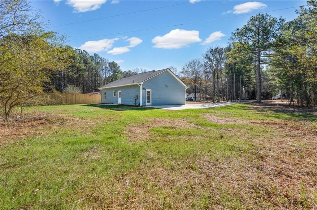 146 Old Brock Road Rockmart, GA 30153 - Photo 40 of 45 a view of a house with a big yard and large trees